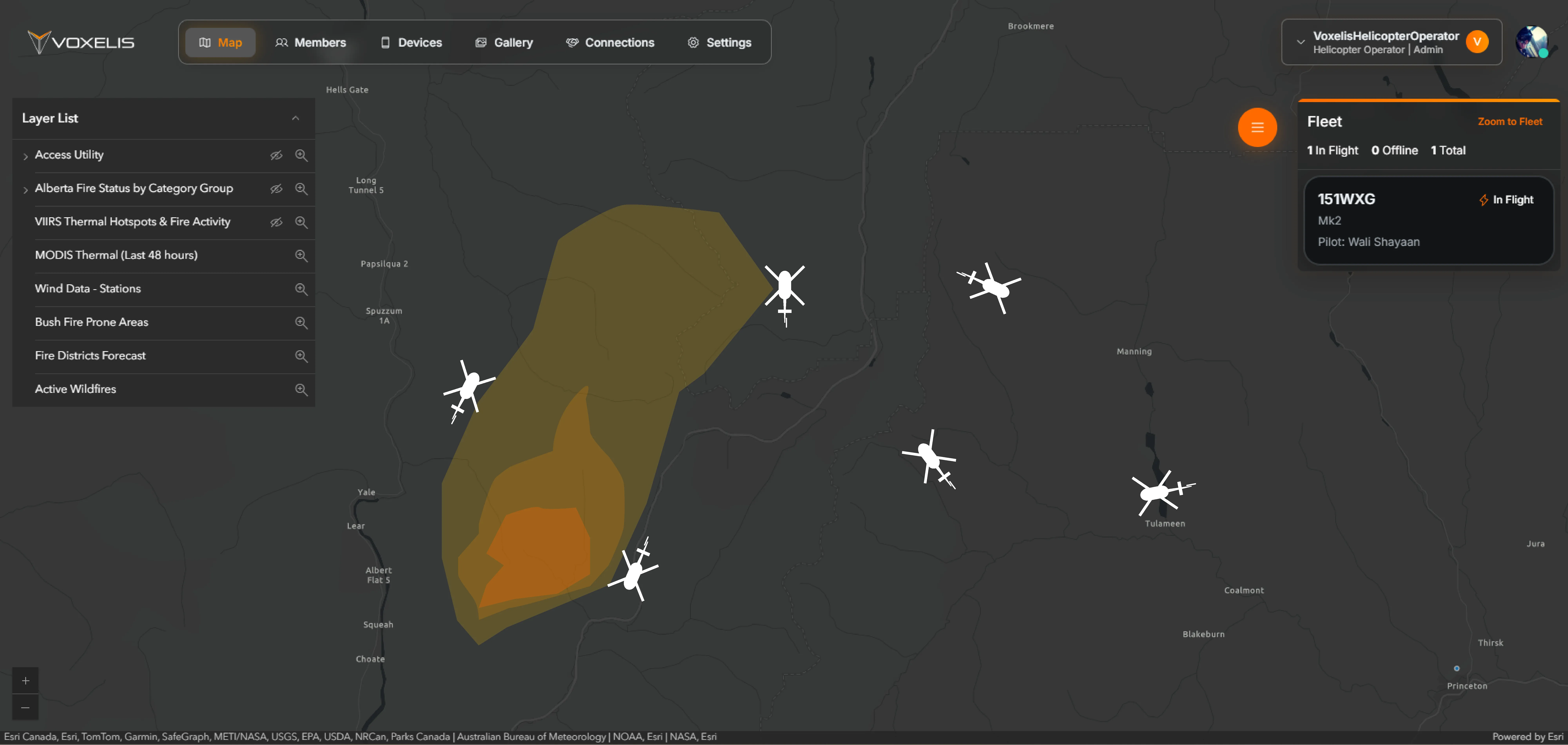 VoxNet portal map view showing fleet positions, an active-wildfire perimeter, and GIS layer controls